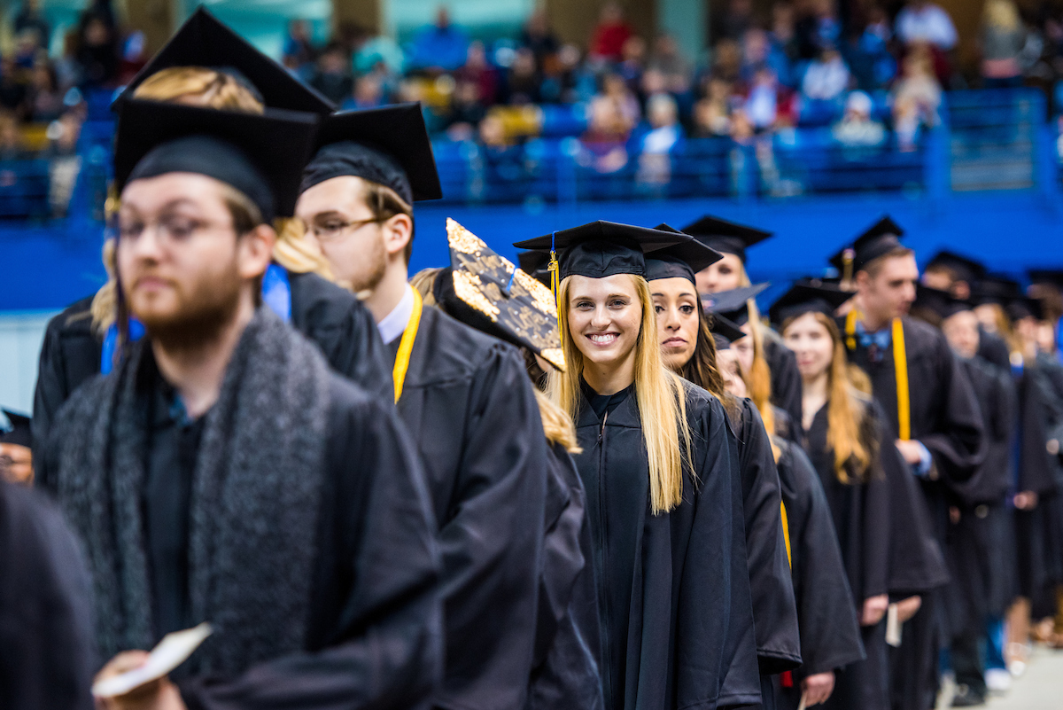 French foreign languages graduate Hannah Sarah Carlile smiles for a photo during commencement 2018. | UAF Photo by Zayn Roohi