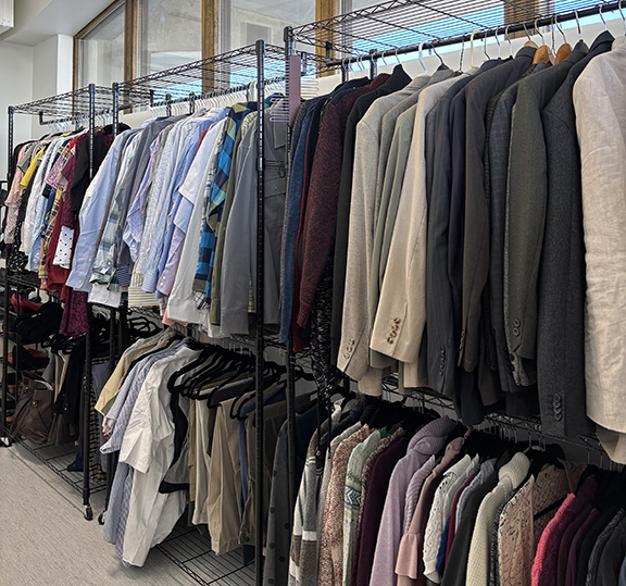 Racks of professional clothing inside the Nanook Career Closet.