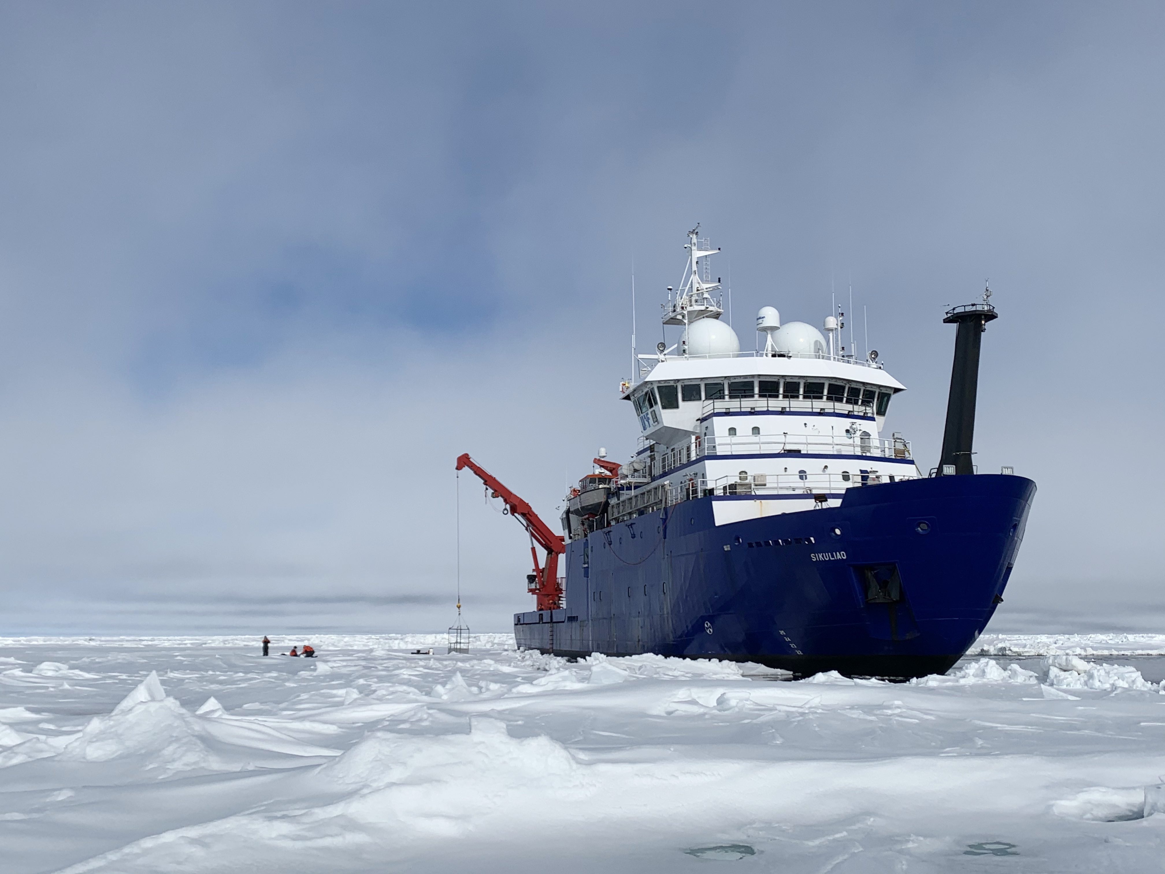 The research vessel Sikuliaq pauses in sea ice in the Arctic Ocean in May 2021.