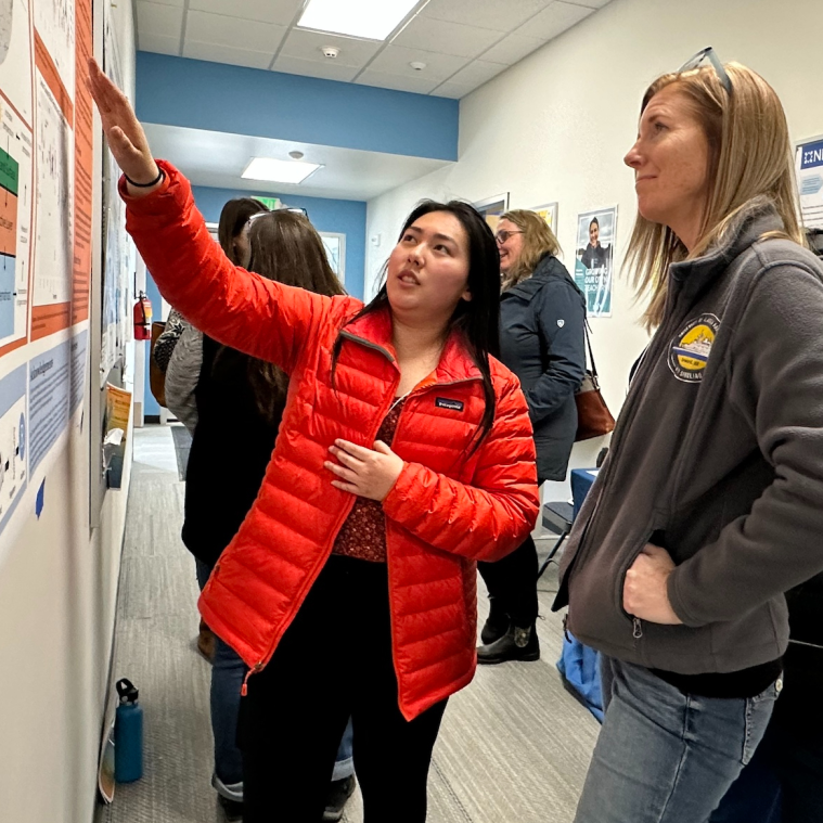UAF undergraduate student Michelle Ramirez (left) explaining her poster to Tara Borland (right) with U.S. National Science Foundation’s Established Program to Stimulate Competitive Research (EPSCoR) during WAISC 2024. Photo by Dave Partee/Alaska Sea Grant.
