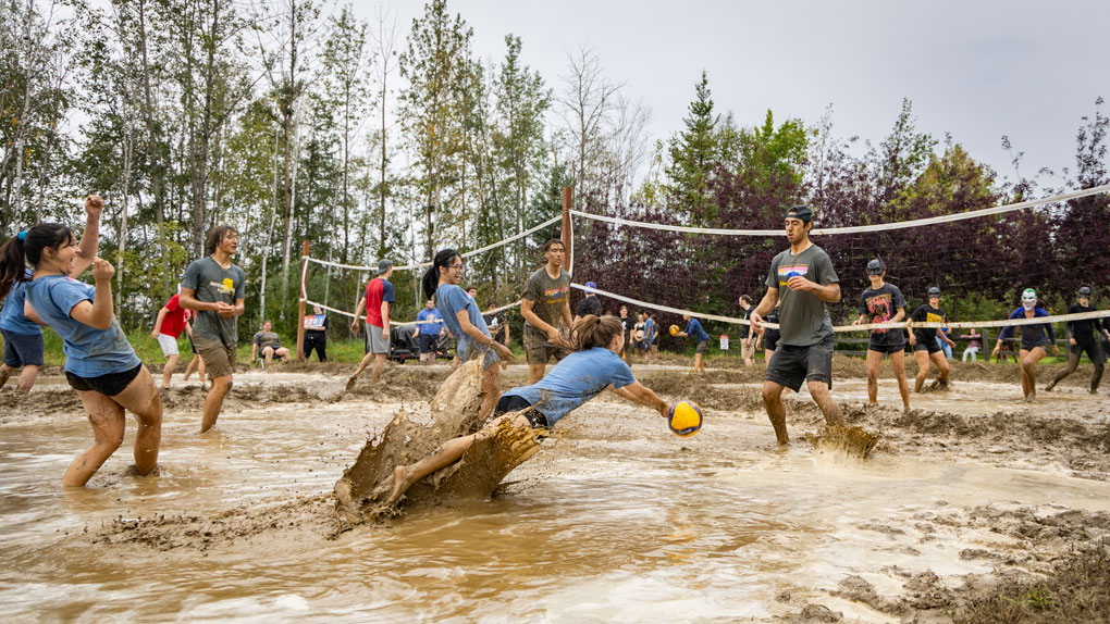 UAF students playing mud volleyball